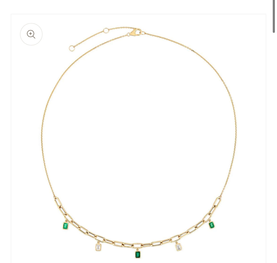 Dangling diamond and emerald necklace
